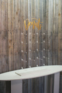 Acrylic Donut Wall Clear, with Gold Donut Text. 43cm x 65cm. Holds 20-40 Donuts. Freestanding