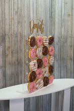 Load image into Gallery viewer, Acrylic Donut Wall Clear, with Gold Donut Text. 43cm x 65cm. Holds 20-40 Donuts. Freestanding